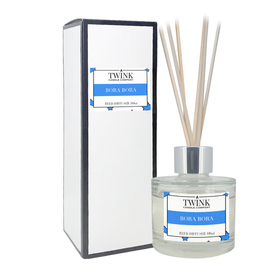 Bora Bora reed diffuser by Twink Candle Company, a 100ml glass bottle with reeds beside its gift box