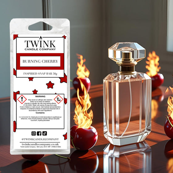 Burning Cherry soy wax melt snap bar by Twink Candle Company, with a perfume bottle, red cherries and flames