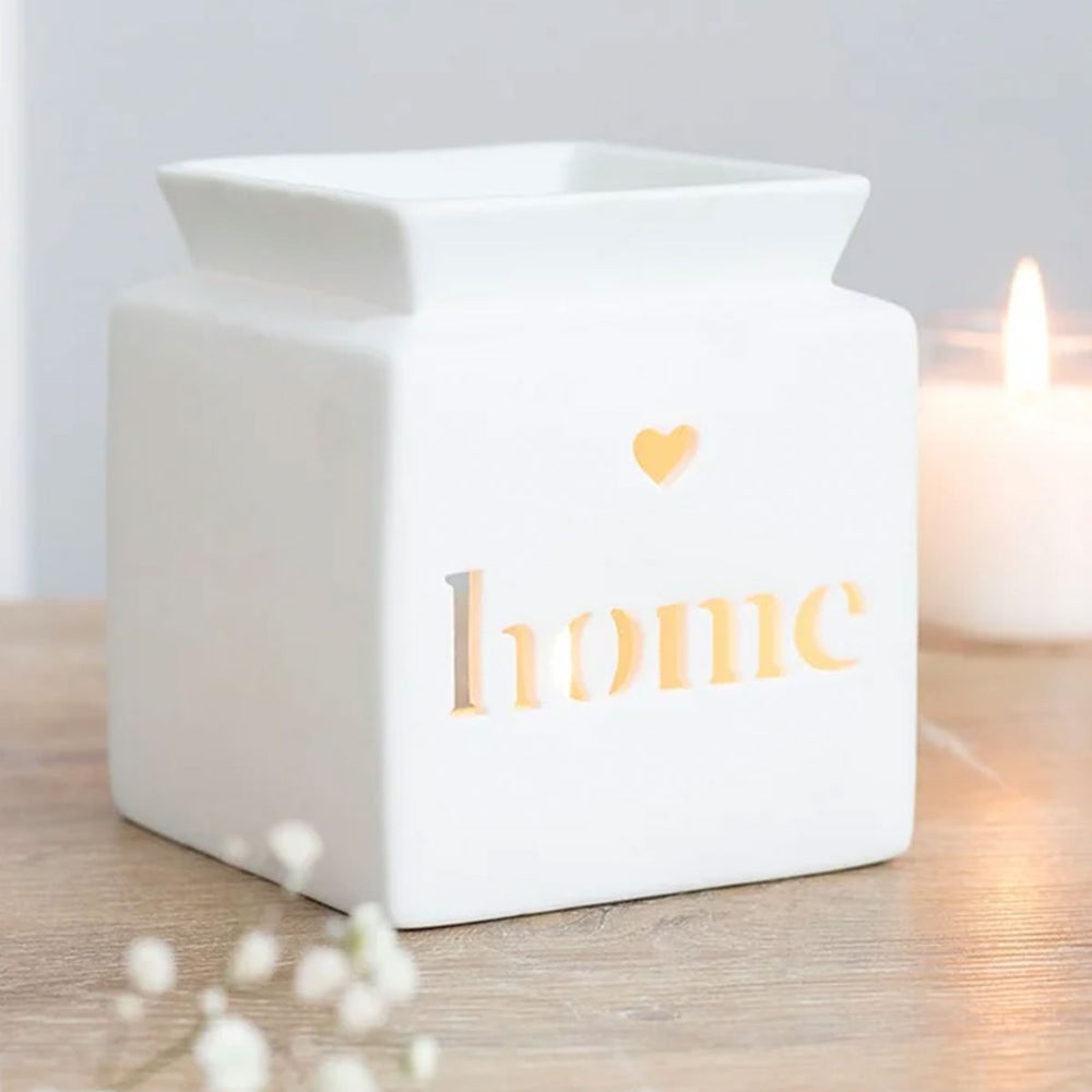 White Home cut-out wax/oil burner by Twink Candle Company — a white ceramic burner with a cut-out heart and 'home' lettering