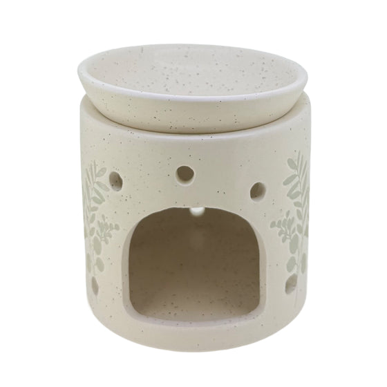 Embossed flower cream wax and oil burner by Twink Candle Company, showing the tea light opening