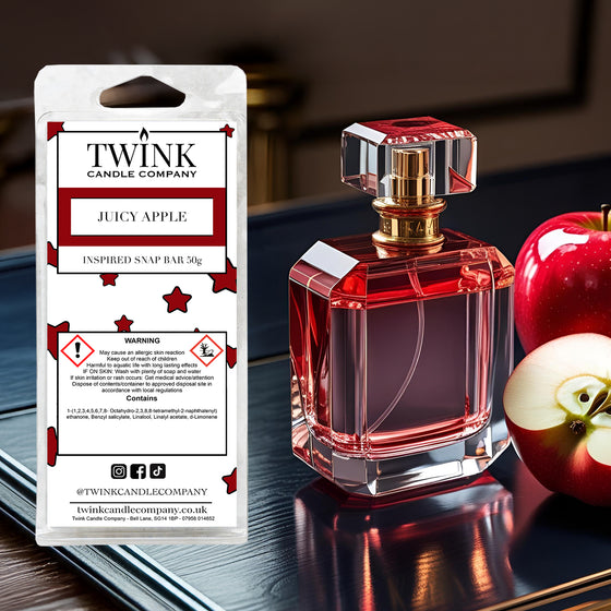 Juicy Apple inspired soy wax melt snap bar by Twink Candle Company, beside a red perfume bottle and fresh apples