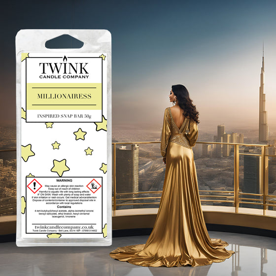 Millionairess inspired soy wax melt snap bar by Twink Candle Company, with a woman in a gold gown against the Dubai skyline