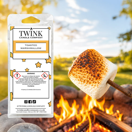 Toasted Marshmallow soy wax melt snap bar by Twink Candle Company, beside a marshmallow toasting over a fire
