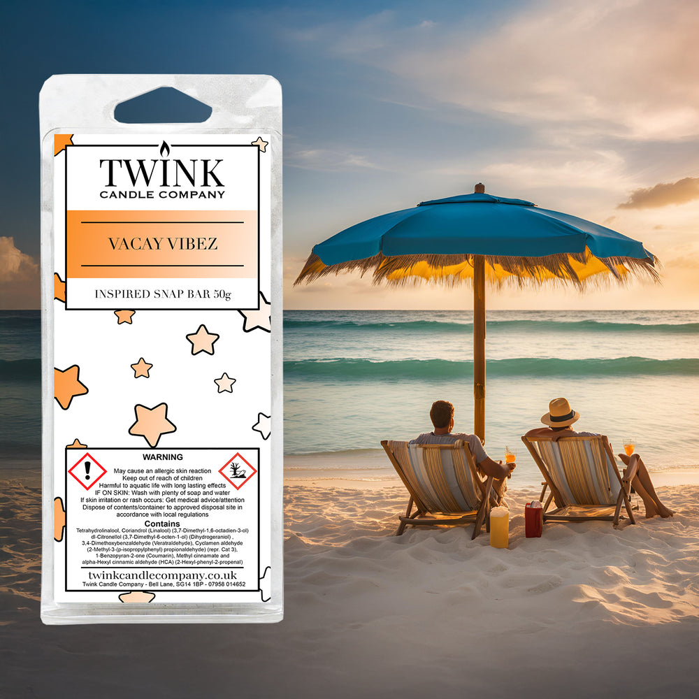 Vacay Vibez inspired soy wax melt snap bar by Twink Candle Company, with two loungers under a parasol on a sunset beach