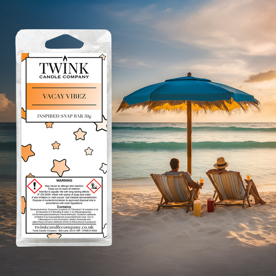 Vacay Vibez inspired soy wax melt snap bar by Twink Candle Company, with two loungers under a parasol on a sunset beach