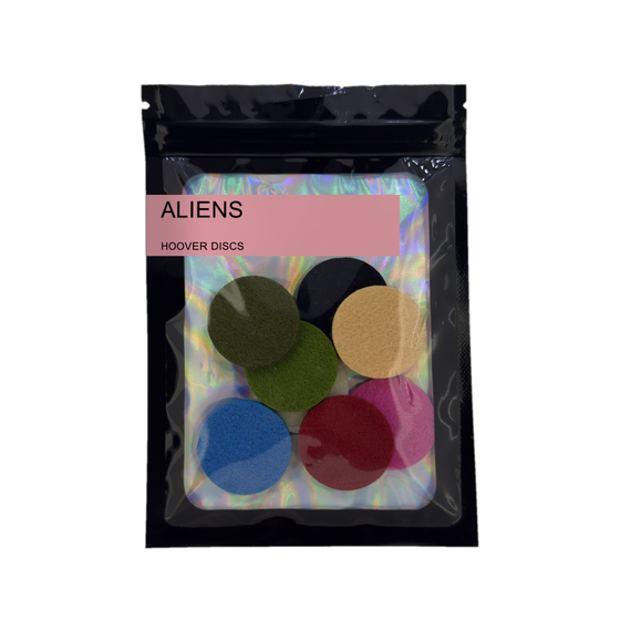 Pack of 8 Aliens scented hoover discs in its sealed black foil packet on a plain white background