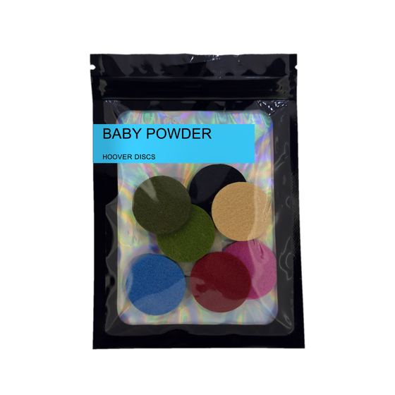 Pack of 8 Baby Powder scented hoover discs in its sealed black foil packet on a plain white background