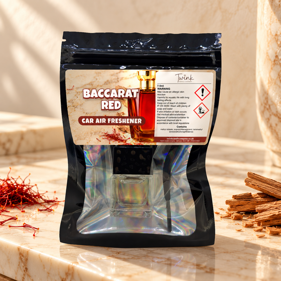 Baccarat Red car air freshener by Twink Candle Company, packet styled in a home setting