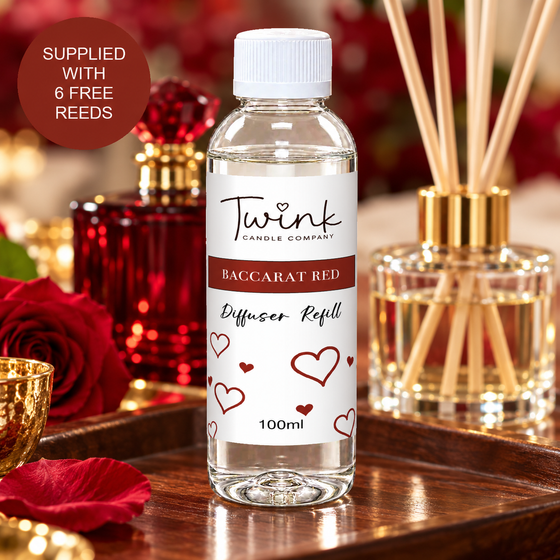 Baccarat Red reed diffuser refill by Twink Candle Company, a 100ml bottle on a walnut tray with deep red roses and a ruby perfume bottle