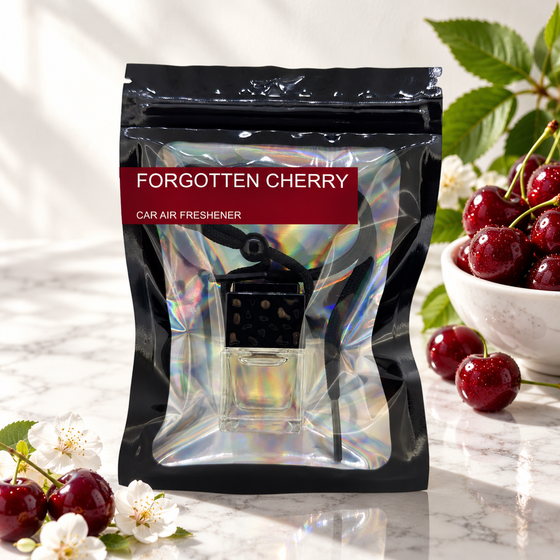 Forgotten Cherry car air freshener by Twink Candle Company, hanging vent diffuser styled in a home setting