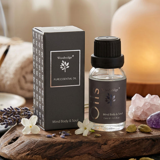 Woodbridge Mind Body & Soul essential oil 15ml — amber fragrance oil bottle for burners and diffusers, in a calm, wellbeing setting