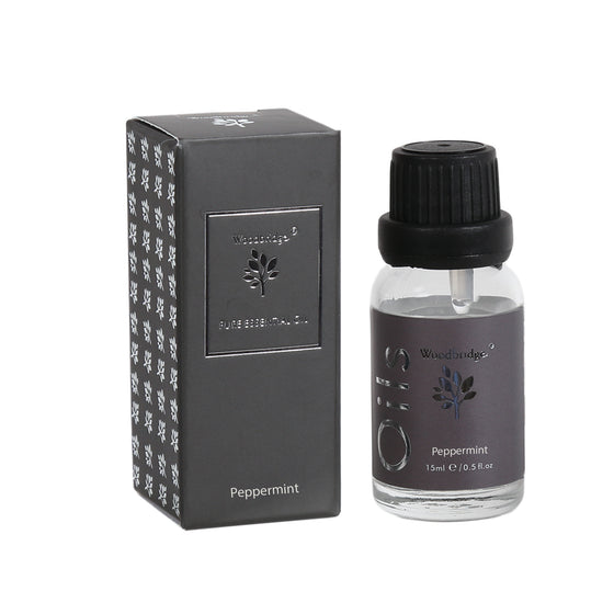 Woodbridge Peppermint essential oil 15ml bottle and box on a white background