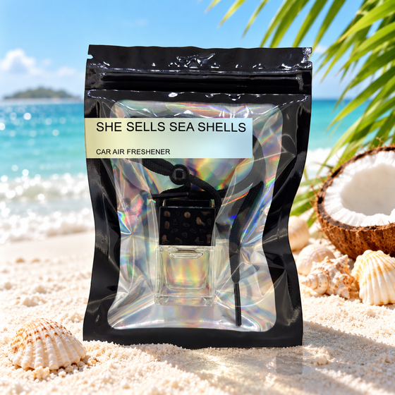 She Sells Sea Shells car air freshener by Twink Candle Company, hanging vent diffuser styled in a home setting