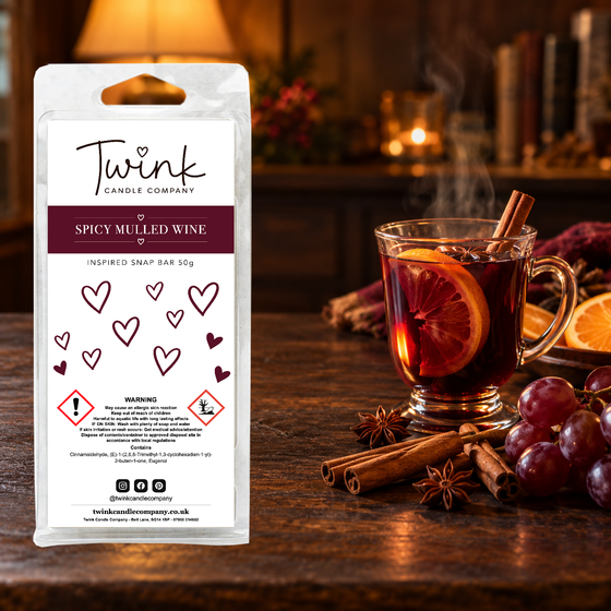 Spicy Mulled Wine inspired soy wax melt snap bar by Twink Candle Company, stood on a dark wood table beside a glass of warm mulled wine, cinnamon sticks and star anise