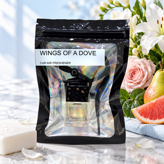 Wings Of A Dove car air freshener by Twink Candle Company, hanging vent diffuser styled in a home setting