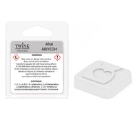 Back of the Ana Abiyedh inspired snap bar packet showing contents and safety information, with a heart-shaped wax sample