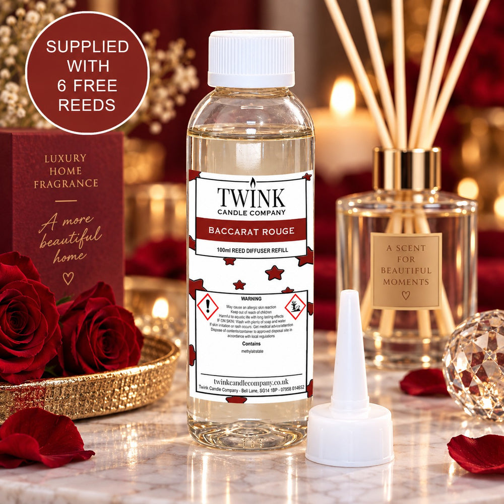 Baccarat Red reed diffuser refill by Twink Candle Company, a 100ml bottle among deep red roses and crystal