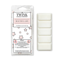 Beautiful Life inspired 50g soy wax melt snap bar in its packet beside the unwrapped bar and its five break-apart segments