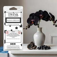Black Orchid inspired soy wax melt snap bar by Twink Candle Company, with dark orchids in a white vase and black stones