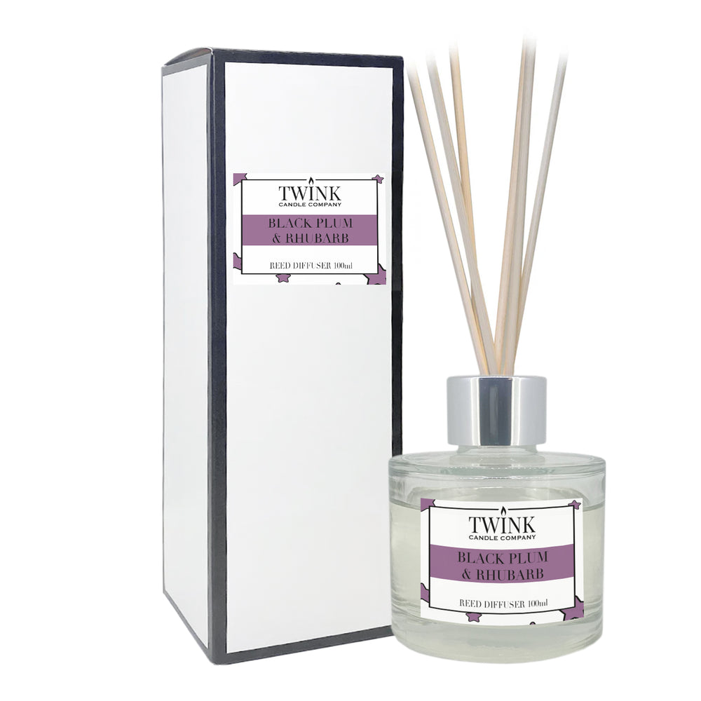 Black Plum & Rhubarb reed diffuser by Twink Candle Company, a 100ml glass bottle with reeds beside its gift box