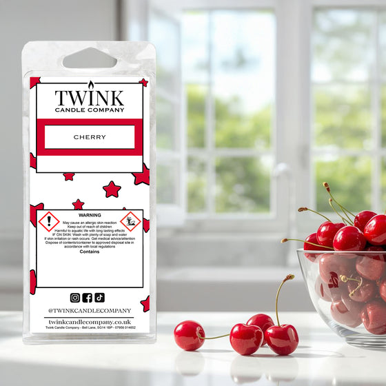 Cherry inspired soy wax melt snap bar by Twink Candle Company, with fresh cherries and a bowl by a window