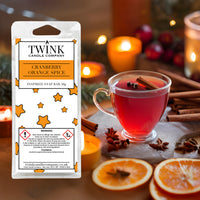 Cranberry Orange Spice soy wax melt snap bar by Twink Candle Company, with a spiced drink, cinnamon sticks and dried orange