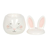 Ceramic bunny rabbit wax and oil burner by Twink Candle Company, shown with the ear lid lifted off