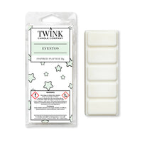 Eventos inspired 50g soy wax melt snap bar in its packet beside the unwrapped bar and its five break-apart segments