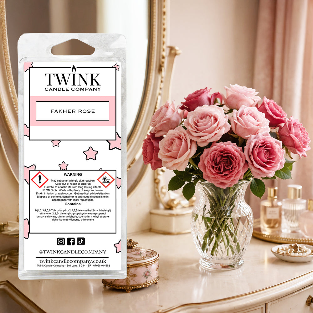 Fakher Rose inspired soy wax melt snap bar by Twink Candle Company, with pink roses in a vase on a dressing table