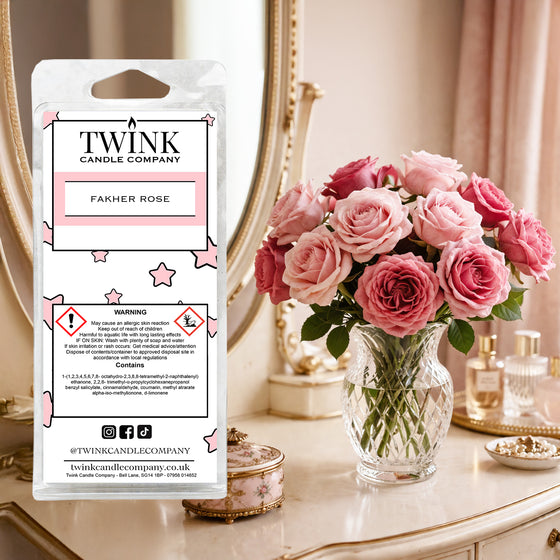 Fakher Rose inspired soy wax melt snap bar by Twink Candle Company, with pink roses in a vase on a dressing table