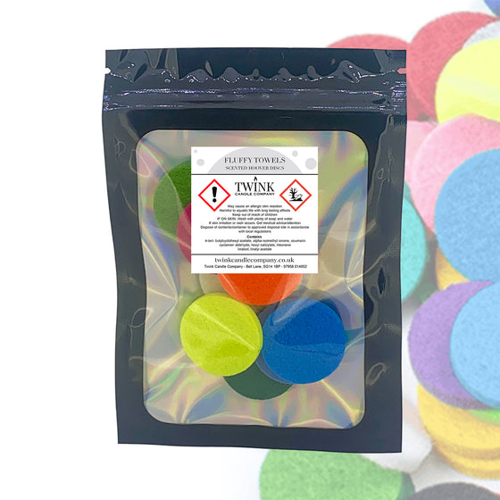 Fluffy Towels scented hoover discs by Twink Candle Company, a resealable pouch of 8 with pastel discs behind