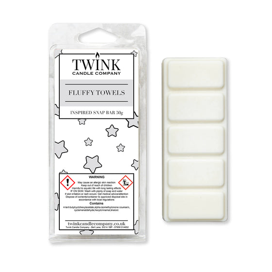 Fluffy Towels inspired 50g soy wax melt snap bar in its packet beside the unwrapped bar and its five break-apart segments