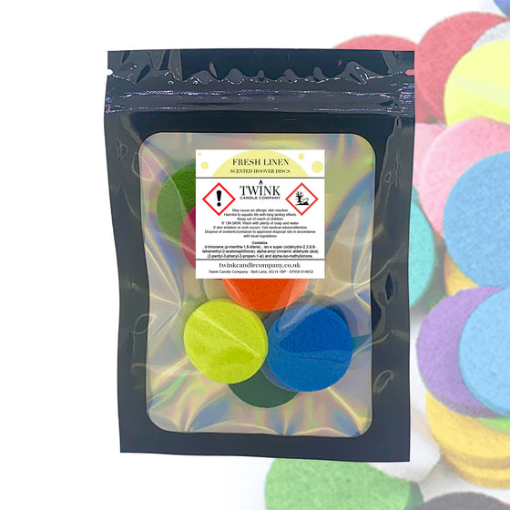 Fresh Linen scented hoover discs by Twink Candle Company, a resealable pouch of 8 with pastel discs behind