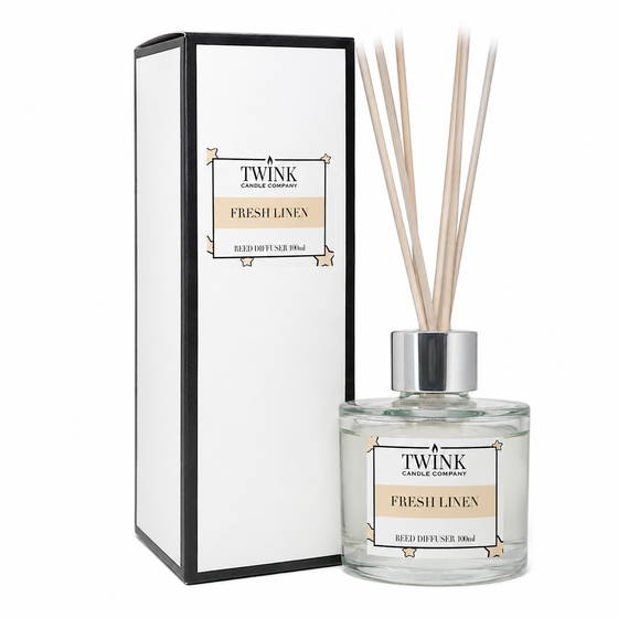 Fresh Linen reed diffuser by Twink Candle Company, a 100ml glass bottle with reeds beside its gift box