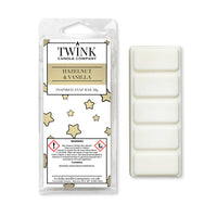 Hazelnut & Vanilla inspired 50g soy wax melt snap bar in its packet beside the unwrapped bar and its five segments