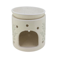 Embossed flower cream wax and oil burner by Twink Candle Company, showing the tea light opening