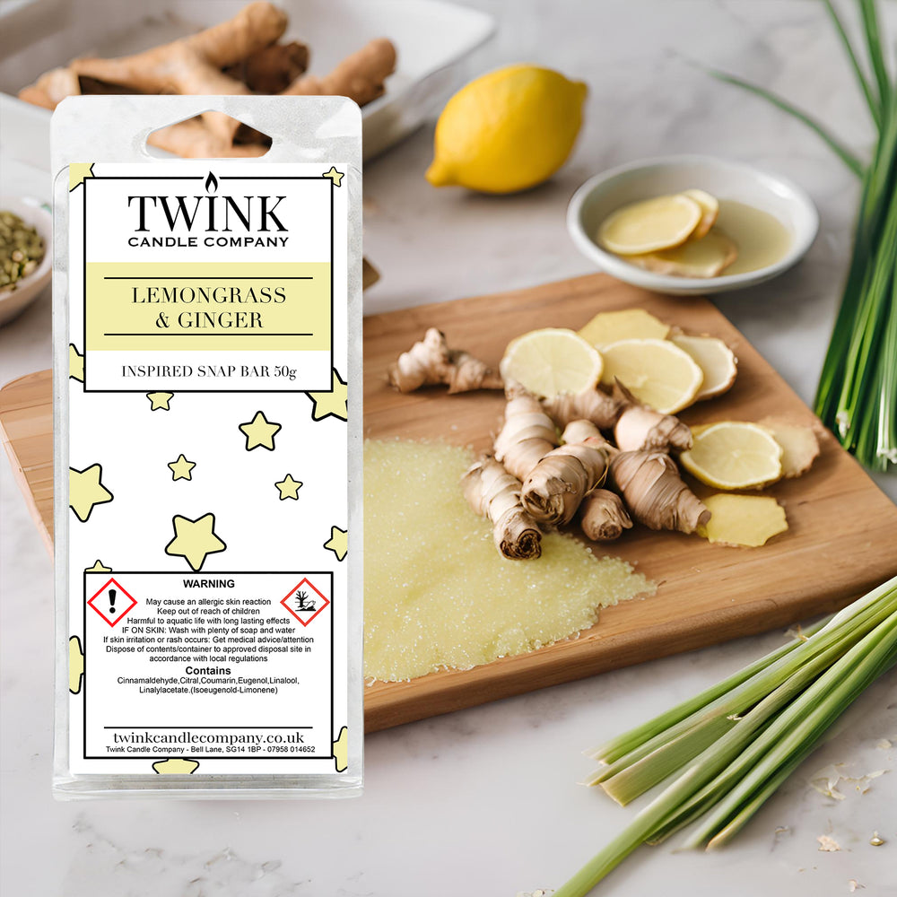 Lemongrass & Ginger soy wax melt snap bar by Twink Candle Company, with ginger root, lemongrass stalks and lemon on a wooden board