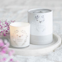Butterflies In Loving Memory candle by Twink Candle Company, shown with its gift box on a marble stand