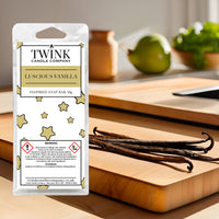 Luscious Vanilla soy wax melt snap bar by Twink Candle Company, with vanilla pods on a wooden board in a sunlit kitchen