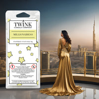 Millionairess inspired soy wax melt snap bar by Twink Candle Company, with a woman in a gold gown against the Dubai skyline