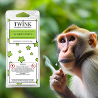 Monkey Farts soy wax melt snap bar by Twink Candle Company, with a monkey holding a leaf among green jungle foliage