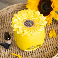 Sunflower wax and oil burner by Twink Candle Company, styled with fresh sunflowers