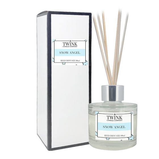 Snow Angel reed diffuser by Twink Candle Company, a 100ml glass bottle with reeds beside its gift box