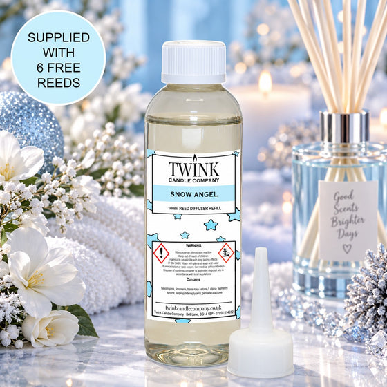 Snow Angel reed diffuser refill by Twink Candle Company, a 100ml bottle in a wintry snow scene with white blossom and reeds