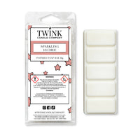 Sparkling Lychee inspired 50g soy wax melt snap bar in its packet beside the unwrapped bar and its five segments