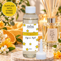 Sunset Blossom reed diffuser refill by Twink Candle Company, a 100ml bottle with citrus and blossom at sunset