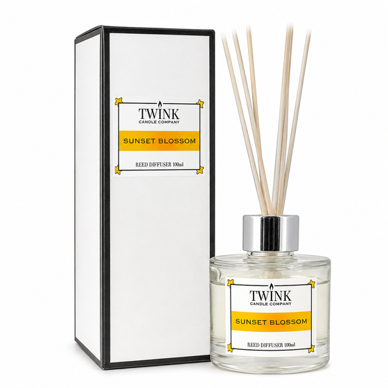 Sunset Blossom reed diffuser by Twink Candle Company, a 100ml glass bottle with reeds beside its gift box
