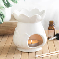 Lotus flower wax and oil burner by Twink Candle Company, lit with a tea light and fragrance oils