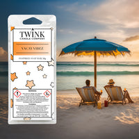 Vacay Vibez inspired soy wax melt snap bar by Twink Candle Company, with two loungers under a parasol on a sunset beach