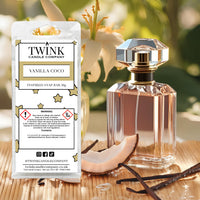 Vanilla Coco inspired soy wax melt snap bar by Twink Candle Company, with a perfume bottle, vanilla pods and flowers